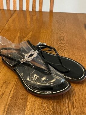 Woman’s Bernardo black patent preowned sandal with rhinestones. Size 9.Like new!